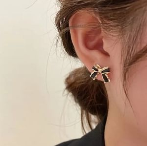 Chic Gold and Black Bow Earrings